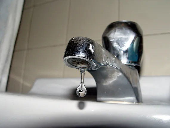 Photo of a leaking faucet