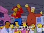 Simpsons animation of billboard ads wrecking buildings with subtitle “Just don’t&nbsp;look”