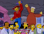 Simpsons animation of billboard ads wrecking buildings with subtitle “Just don’t&nbsp;look”